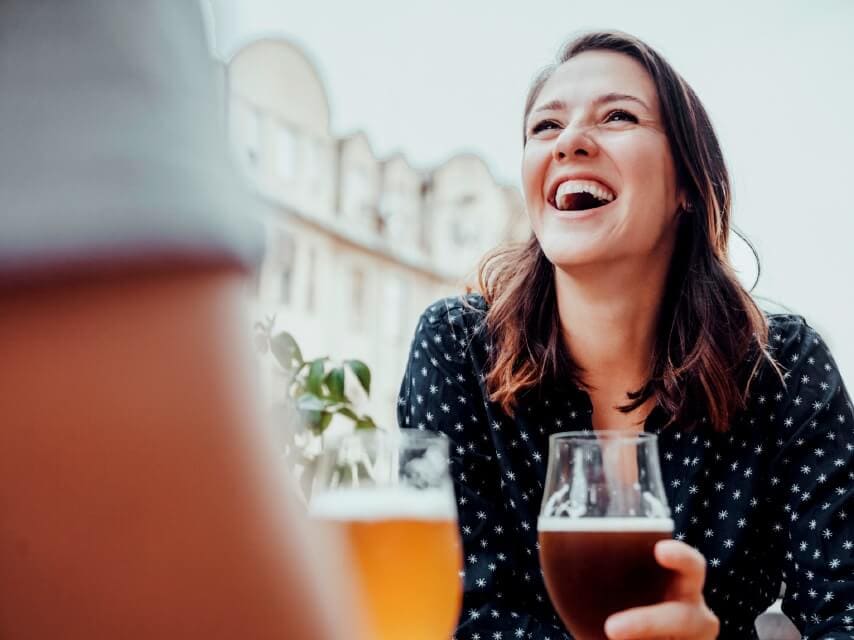 woman enjoying beer and good company
